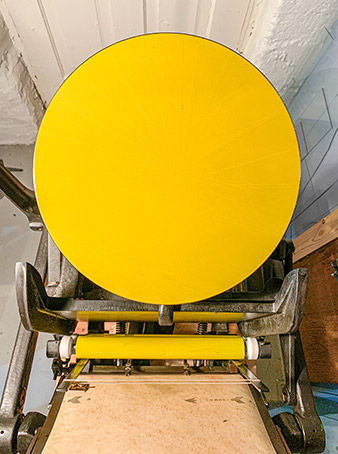 Yellow ink on the platen press
